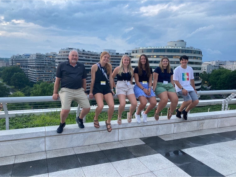 Students gather on a high balcony overlooking Nixon monument also known as Watergate building