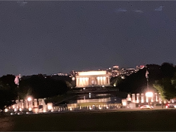 The Supreme Court building at night.